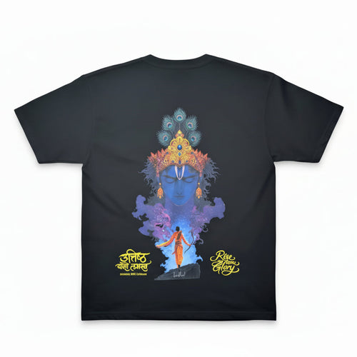 Black t-shirt with colorful graphic design on a hanger against a light pink background